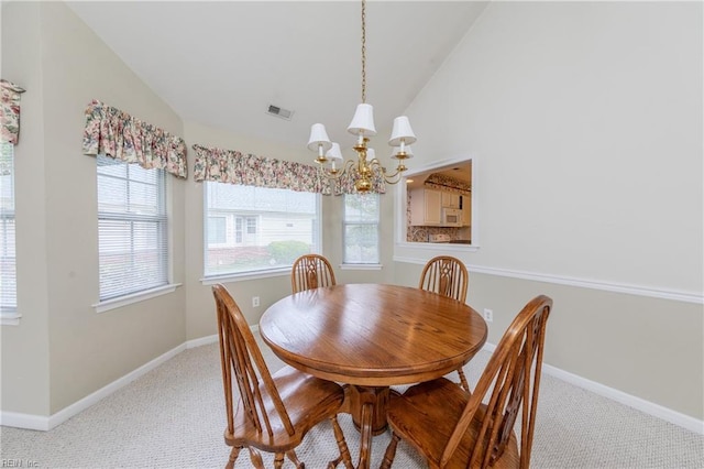 238 Wingate Dr, Williamsburg, VA 23185 - dining space featuring vaulted ceiling, a chandelier, plenty of natural light, and light colored carpet