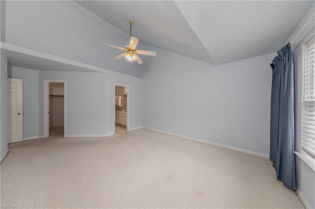238 Wingate Dr, Williamsburg, VA 23185 - unfurnished bedroom featuring lofted ceiling, light colored carpet, a walk in closet, multiple windows, and ceiling fan