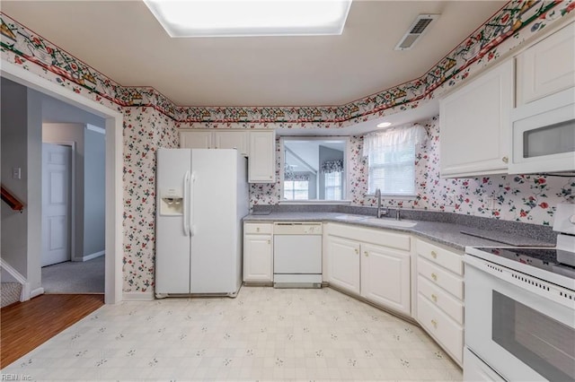 238 Wingate Dr, Williamsburg, VA 23185 - kitchen featuring white appliances, wallpapered walls, white cabinets, and light floors