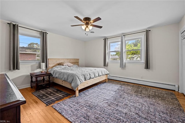 404 Briarfield Dr, Chesapeake, VA 23322 - bedroom with a baseboard radiator, light wood-style flooring, and a ceiling fan