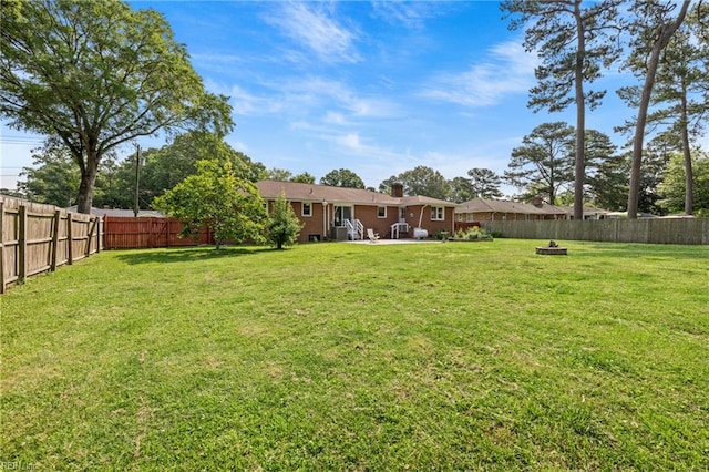 404 Briarfield Dr, Chesapeake, VA 23322 - view of yard with a patio area and a fire pit