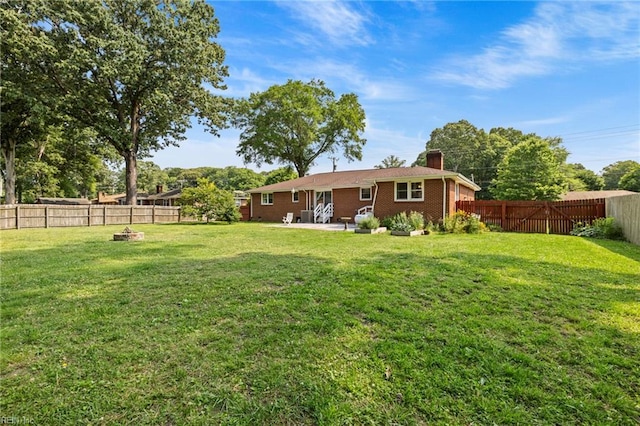 404 Briarfield Dr, Chesapeake, VA 23322 - rear view of house with a chimney, a fire pit, a patio, and brick siding
