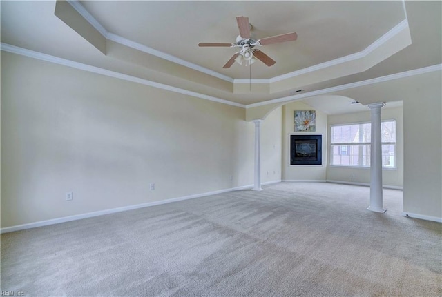 5233 Winery Dr, Chesapeake, VA 23321 - unfurnished living room with decorative columns, a raised ceiling, a ceiling fan, a glass covered fireplace, and carpet floors