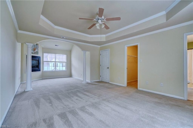 5233 Winery Dr, Chesapeake, VA 23321 - unfurnished living room featuring a tray ceiling, ornate columns, ceiling fan, carpet floors, and crown molding