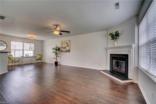 5233 Winery Dr, Chesapeake, VA 23321 - unfurnished living room featuring a glass covered fireplace, wood finished floors, a ceiling fan, and baseboards
