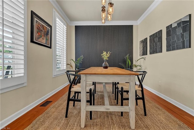 921 Justin Lee Way, Chesapeake, VA 23322 - dining room featuring crown molding, wood finished floors, and baseboards