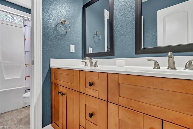921 Justin Lee Way, Chesapeake, VA 23322 - bathroom featuring a textured wall, double vanity, toilet, tile patterned flooring, and shower / tub combo