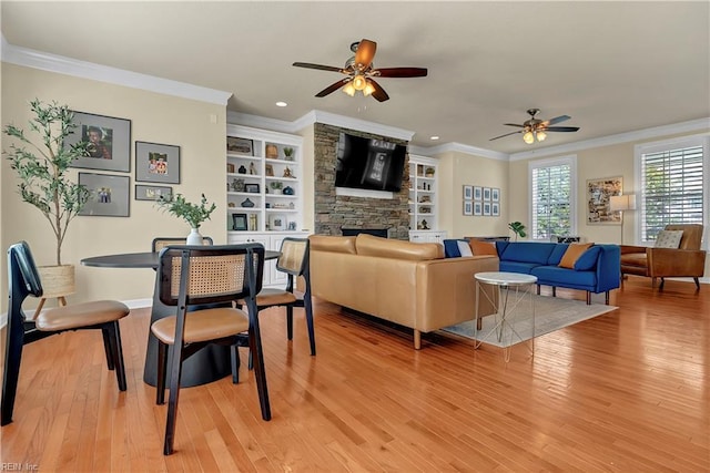 921 Justin Lee Way, Chesapeake, VA 23322 - living room featuring a ceiling fan, ornamental molding, light wood-style flooring, recessed lighting, and a stone fireplace
