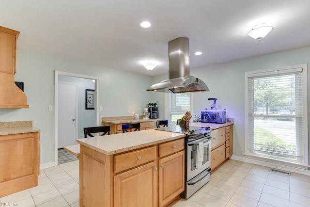 20 Hatteras Lndg, Hampton, VA 23669 - kitchen with stainless steel range with electric cooktop, island range hood, light countertops, light tile patterned flooring, and recessed lighting