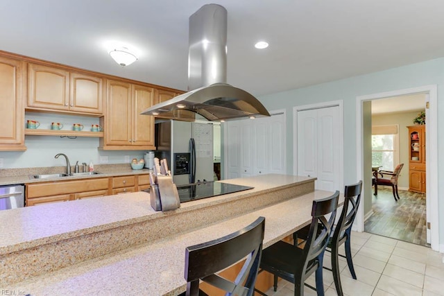 20 Hatteras Lndg, Hampton, VA 23669 - kitchen featuring a sink, island exhaust hood, a breakfast bar, stainless steel appliances, and light tile patterned flooring