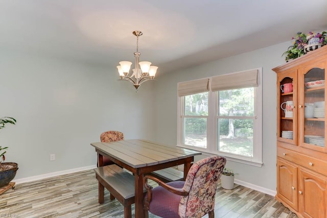 20 Hatteras Lndg, Hampton, VA 23669 - dining space with a chandelier, light wood-style flooring, and baseboards