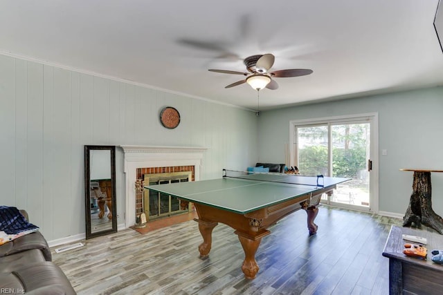 20 Hatteras Lndg, Hampton, VA 23669 - recreation room with a ceiling fan, wood finished floors, a fireplace, crown molding, and baseboards