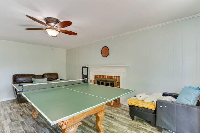 20 Hatteras Lndg, Hampton, VA 23669 - recreation room with wood finished floors, a ceiling fan, crown molding, and a fireplace