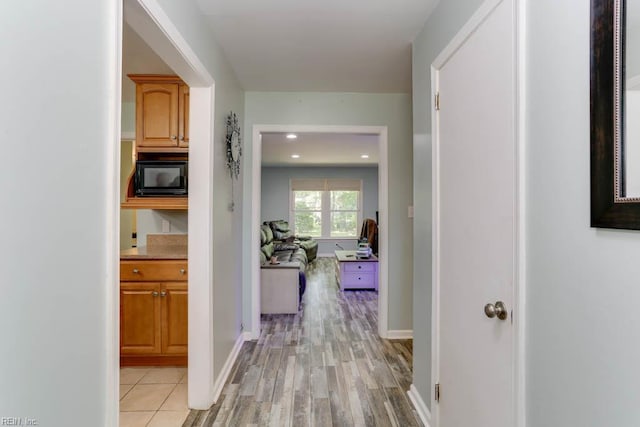 20 Hatteras Lndg, Hampton, VA 23669 - hallway with light wood-style floors and baseboards