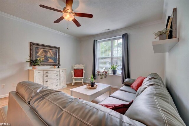 401 Blue Heron Trl, Carrollton, VA 23314 - living area featuring a ceiling fan, light wood-type flooring, baseboards, and ornamental molding