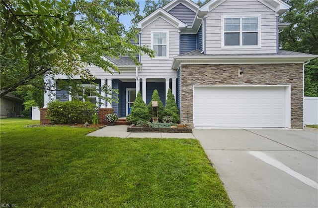 700 Dickens Pl, Chesapeake, VA 23322 - view of front facade with stone siding, concrete driveway, an attached garage, and a front lawn