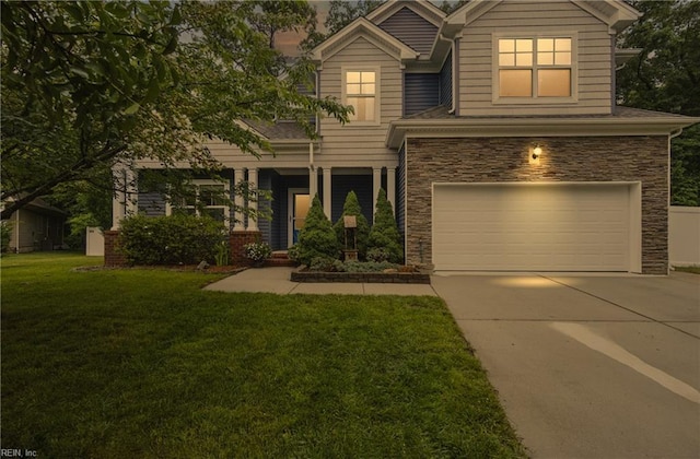 700 Dickens Pl, Chesapeake, VA 23322 - view of front of home featuring an attached garage, stone siding, concrete driveway, and a front yard