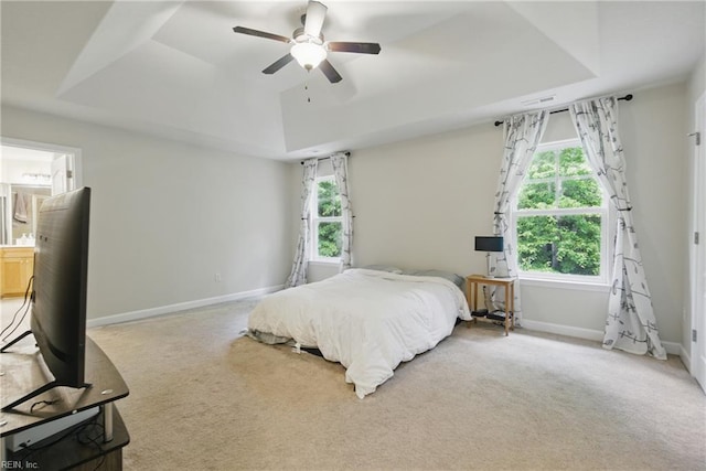 700 Dickens Pl, Chesapeake, VA 23322 - carpeted bedroom with a raised ceiling, baseboards, ensuite bathroom, and ceiling fan