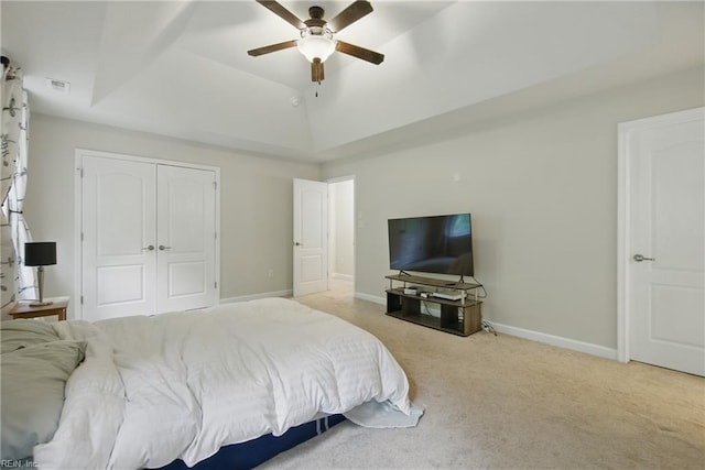 700 Dickens Pl, Chesapeake, VA 23322 - carpeted bedroom with a tray ceiling, a closet, ceiling fan, and baseboards
