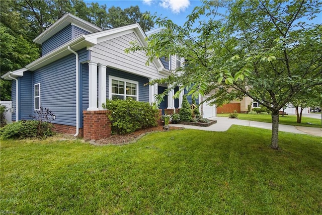 700 Dickens Pl, Chesapeake, VA 23322 - view of front facade featuring driveway, a front lawn, and an attached garage