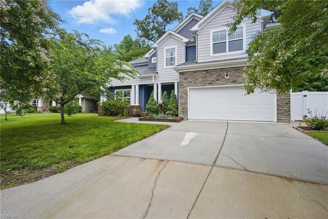 700 Dickens Pl, Chesapeake, VA 23322 - view of front of property featuring stone siding, an attached garage, and concrete driveway