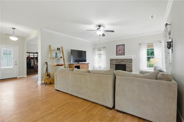 700 Dickens Pl, Chesapeake, VA 23322 - living room featuring light wood-style floors, a ceiling fan, a fireplace, ornamental molding, and baseboards