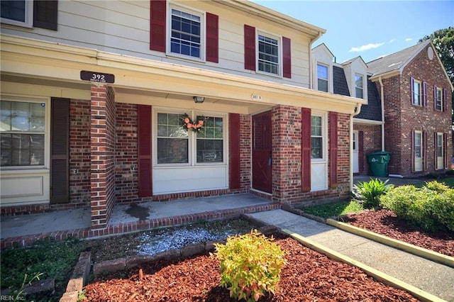 392 Deputy Ln Unit D, Newport News, VA 23608 - property entrance featuring brick siding and a porch