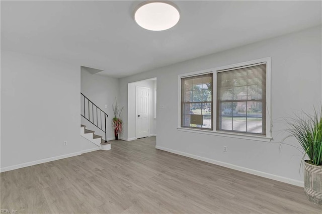 392 Deputy Ln Unit D, Newport News, VA 23608 - unfurnished living room featuring light wood-style floors, stairway, and baseboards