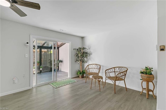 392 Deputy Ln Unit D, Newport News, VA 23608 - living area with wood finished floors, a ceiling fan, baseboards, and a sunroom