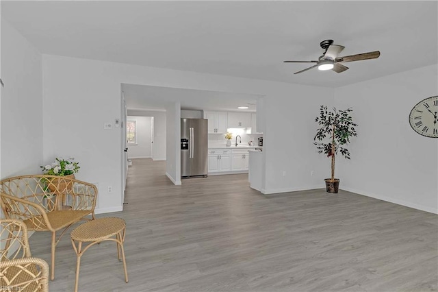 392 Deputy Ln Unit D, Newport News, VA 23608 - living area with a ceiling fan, light wood-style flooring, and baseboards