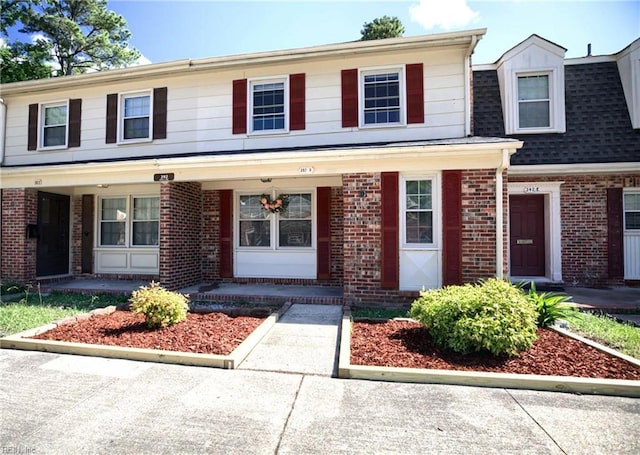 392 Deputy Ln Unit D, Newport News, VA 23608 - multi unit property with brick siding, covered porch, and a shingled roof