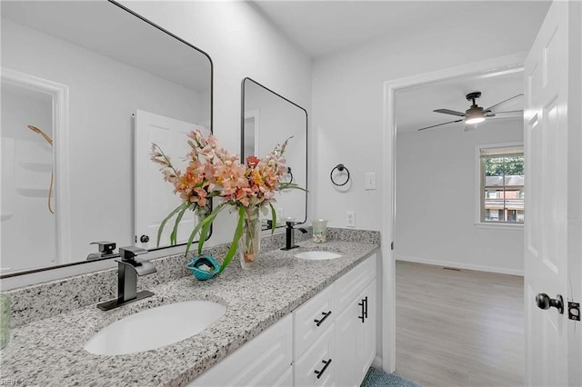 392 Deputy Ln Unit D, Newport News, VA 23608 - bathroom featuring double vanity, wood finished floors, a ceiling fan, and baseboards