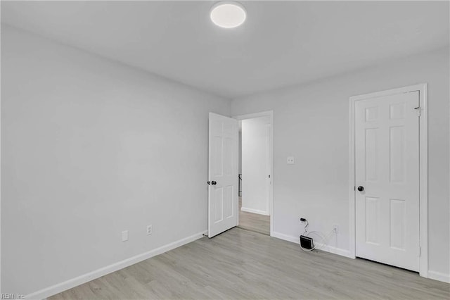 392 Deputy Ln Unit D, Newport News, VA 23608 - unfurnished bedroom with wood finished floors and baseboards