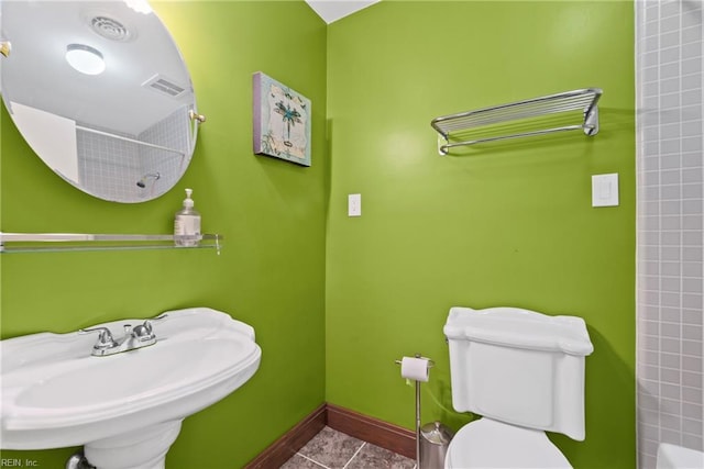 7720 Dunfield Pl Unit A3, Norfolk, VA 23505 - full bath with a sink, toilet, tile patterned flooring, baseboards, and shower / bath combination