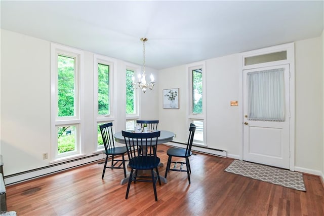 5209 Studeley Ave, Norfolk, VA 23508 - dining area with a baseboard radiator, wood finished floors, a chandelier, and baseboards