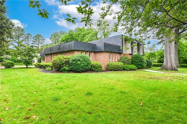 5209 Studeley Ave, Norfolk, VA 23508 - view of side of property featuring mansard roof, a lawn, and brick siding