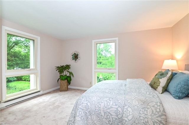 5209 Studeley Ave, Norfolk, VA 23508 - carpeted bedroom with multiple windows, baseboard heating, and baseboards