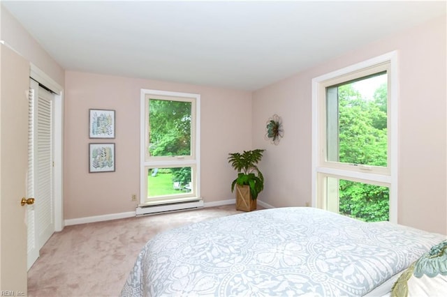 5209 Studeley Ave, Norfolk, VA 23508 - bedroom with baseboard heating, light colored carpet, and baseboards