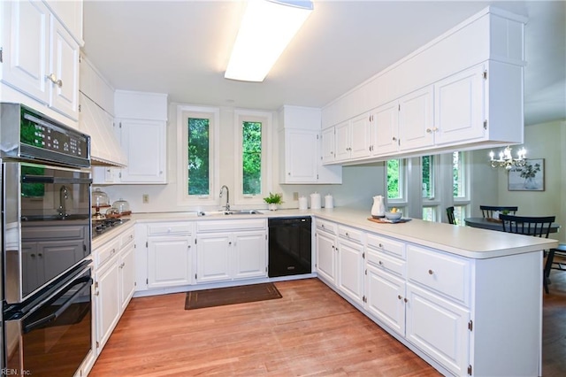 5209 Studeley Ave, Norfolk, VA 23508 - kitchen with black appliances, a sink, a peninsula, light countertops, and plenty of natural light
