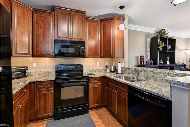 5413 Foundation St, Williamsburg, VA 23188 - kitchen with black appliances, a sink, light wood-style flooring, light stone counters, and open floor plan
