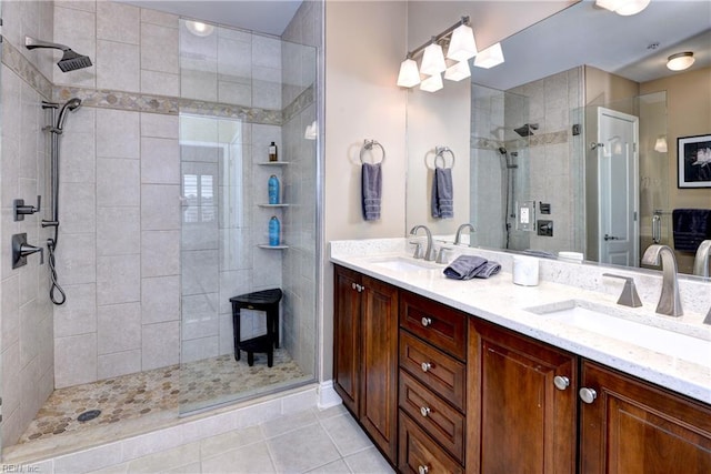 5413 Foundation St, Williamsburg, VA 23188 - bathroom with a tile shower, double vanity, a wood stove, and tile patterned flooring