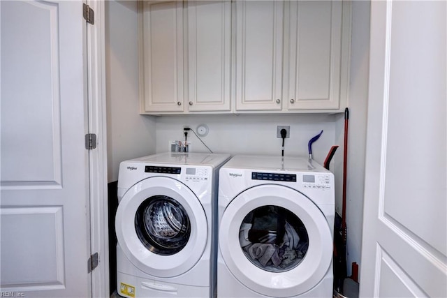 5413 Foundation St, Williamsburg, VA 23188 - laundry area featuring washing machine and dryer and cabinet space
