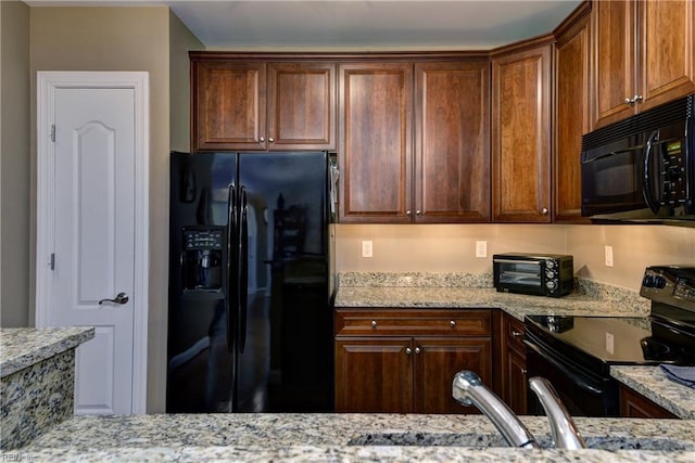 5413 Foundation St, Williamsburg, VA 23188 - kitchen with black appliances and light stone countertops