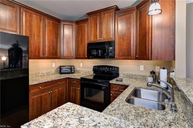 5413 Foundation St, Williamsburg, VA 23188 - kitchen featuring black appliances, a sink, light stone countertops, and brown cabinets