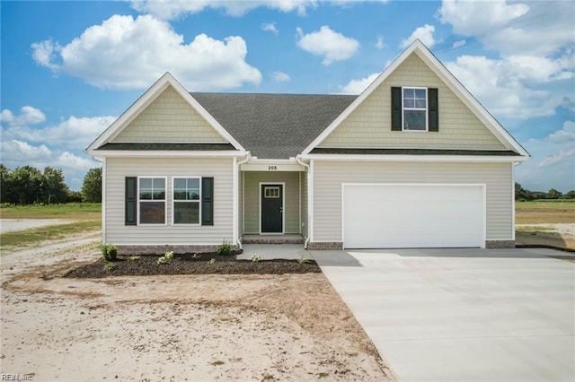 23041 Calvin Dr, Franklin, VA 23851 - craftsman house with concrete driveway, a garage, and a shingled roof