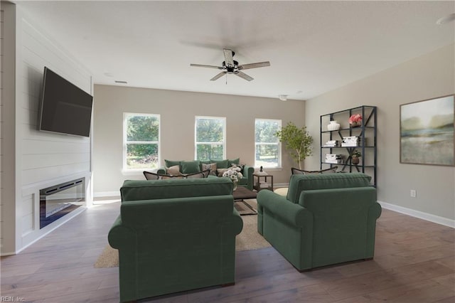 23041 Calvin Dr, Franklin, VA 23851 - living room with a ceiling fan, wood finished floors, a fireplace, and baseboards