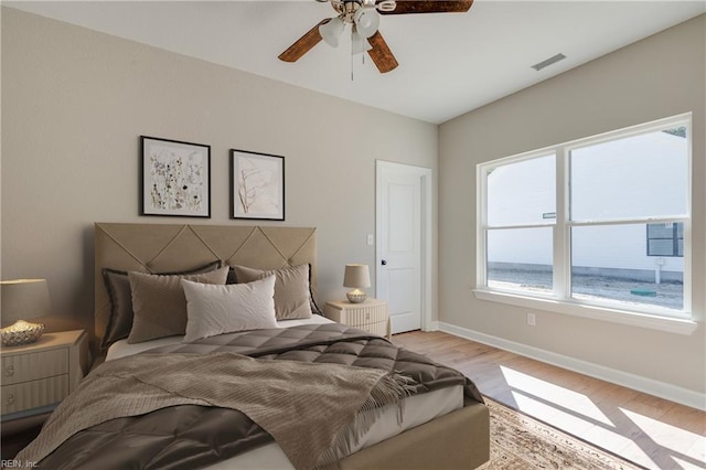 23041 Calvin Dr, Franklin, VA 23851 - bedroom with wood finished floors, baseboards, and ceiling fan