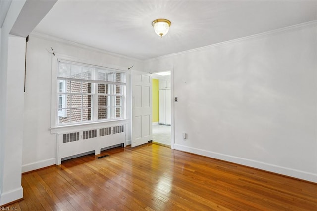 3403 Chesapeake Ave, Hampton, VA 23661 - unfurnished room with radiator heating unit, hardwood / wood-style flooring, baseboards, and ornamental molding