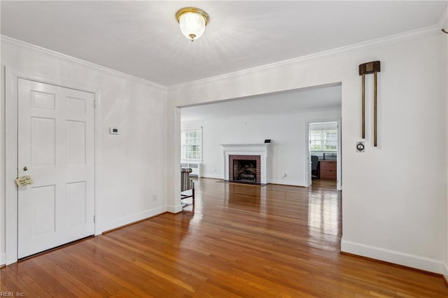 3403 Chesapeake Ave, Hampton, VA 23661 - unfurnished living room featuring wood finished floors, crown molding, baseboards, and a fireplace