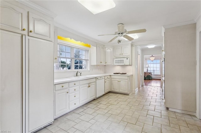 3403 Chesapeake Ave, Hampton, VA 23661 - kitchen with white appliances, a sink, crown molding, ceiling fan, and light countertops